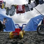 A girl runs at a temporary tent camp set up for Ukrainian refugees in the town of Novoshakhtinsk in the Rostov region near the Russian-Ukrainian border, southern Russia, July 9, 2014. REUTERS/Sergei Karpukhin